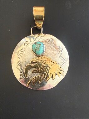 Genevieve Jones Native Najavo Eagle Pendant
.925 Sterling with Gold overlay.